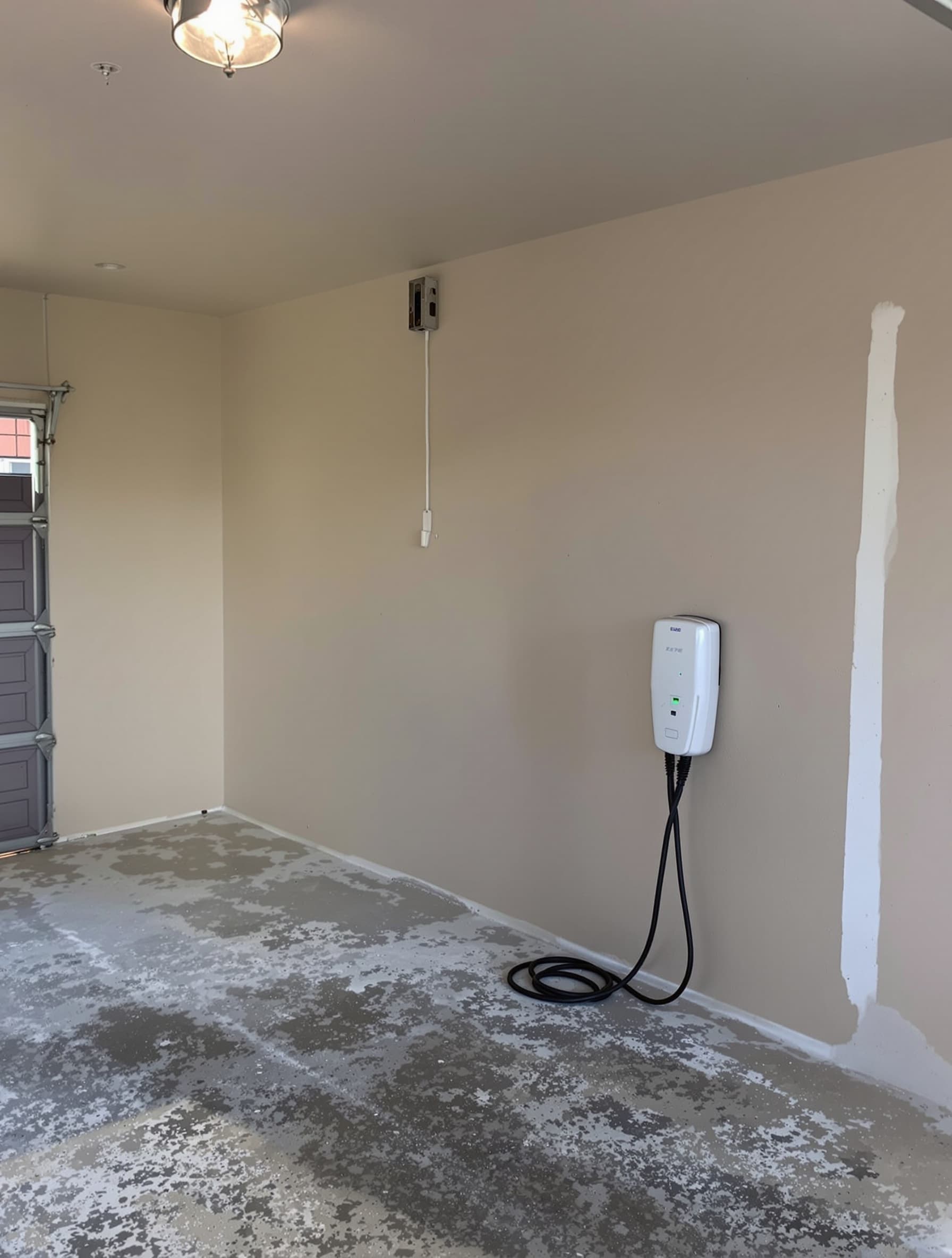 Empty garage wall in Smithtown before Tesla EV charger install
